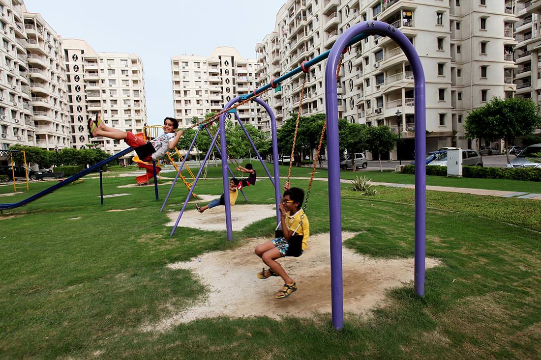 Kids Enjoying Swings at Ashiana Aangan, Bhiwadi